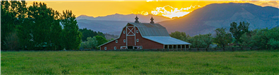 Midway Barn and Mountains by Kris Stewart