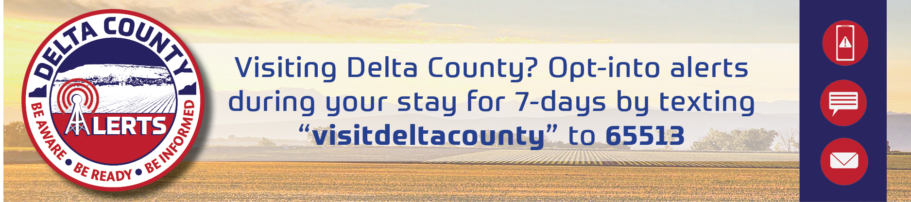Alert logo on picture of field. Directs tourists to text \"visitdeltacounty\" to 65513